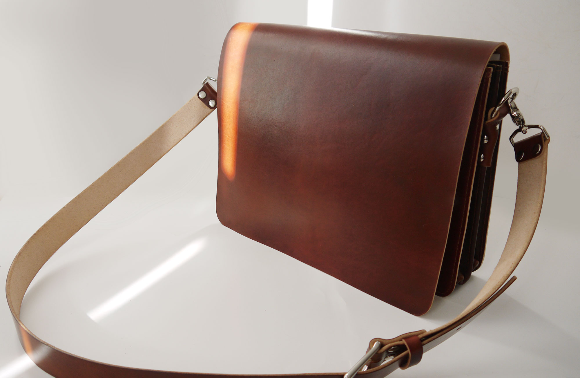 Light brown leather messenger bag